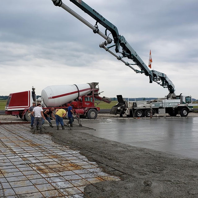 SEMO concrete pump onsite with workers